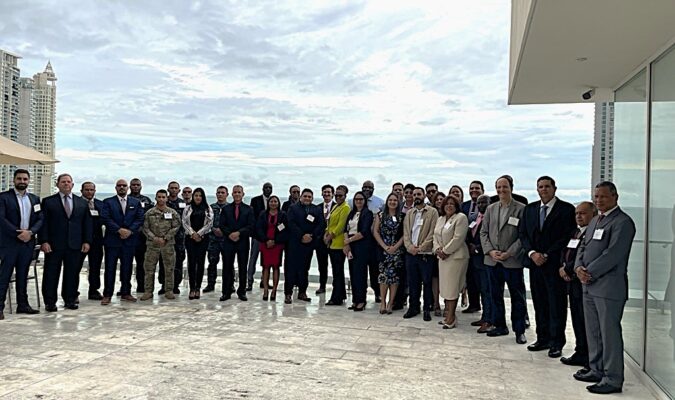 group in front of waterfront