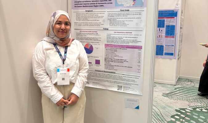 Sereen Irweir in front of poster