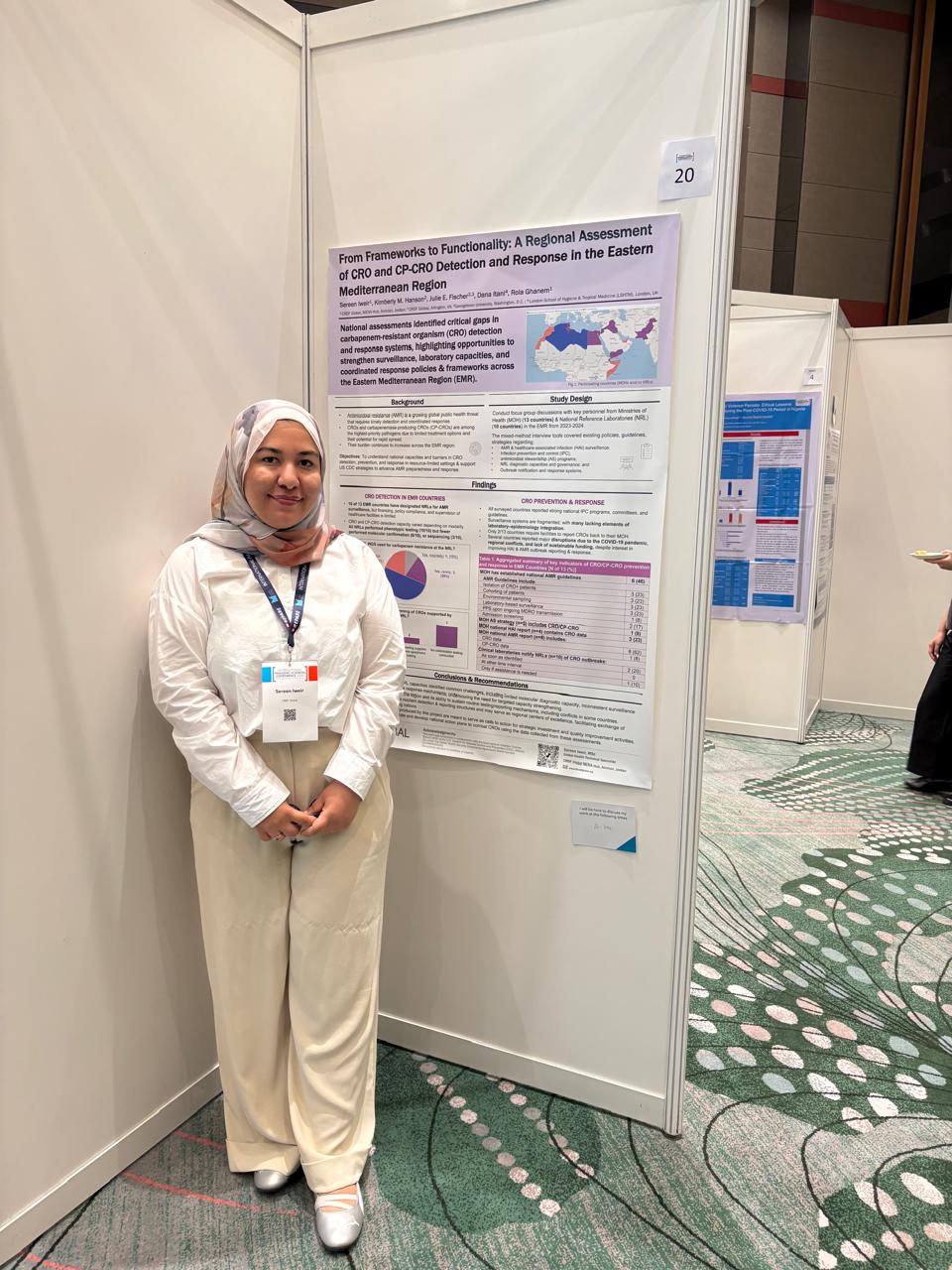 Sereen Irweir in front of poster